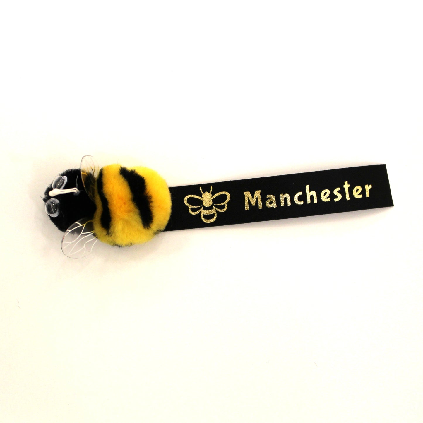 Fuzzy stick on bee with Manchester label