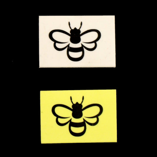 Yellow or White eraser featuring black outline of a bee